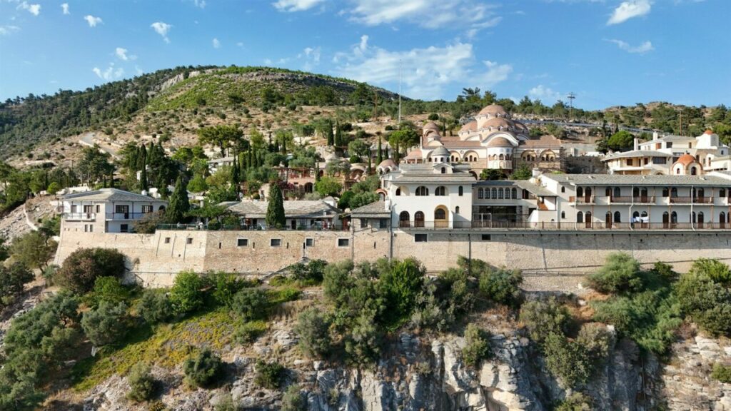 The Monastery of the Archangel Michael on a cliff above the sea, seen from a drone, Thassos