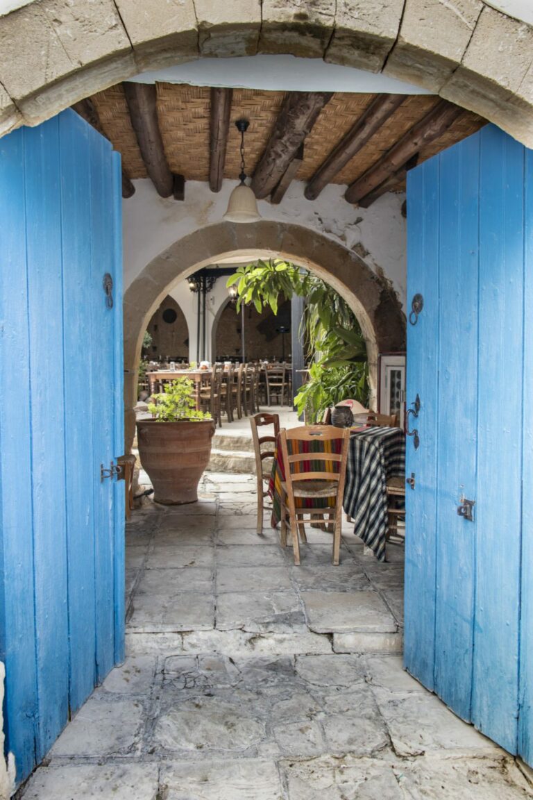 A blue door at the entrance to a traditional taverna in Cyprus