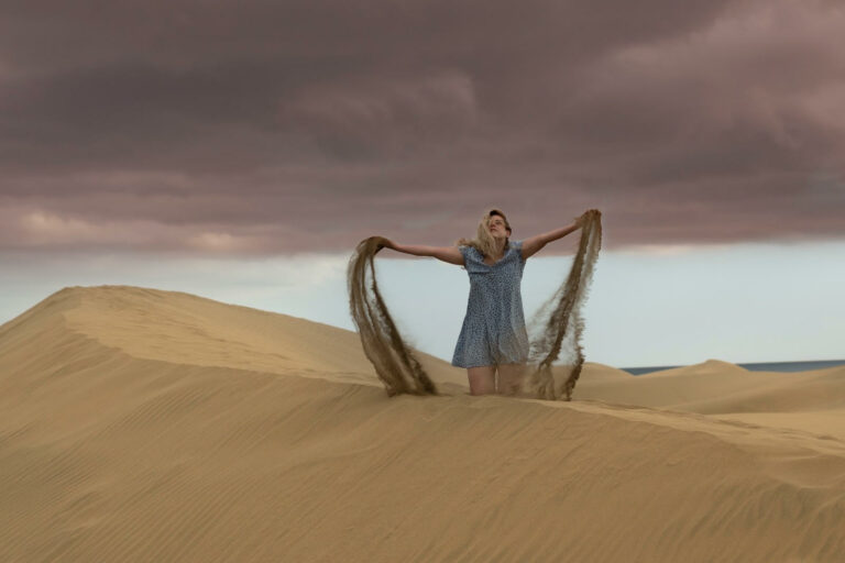 A woman on the sand dunes of Maspalomas, Gran Canaria