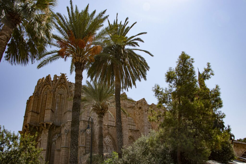 The Gothic Cathedral of St Nicholas behind palm trees in Famagusta, North Cyprus